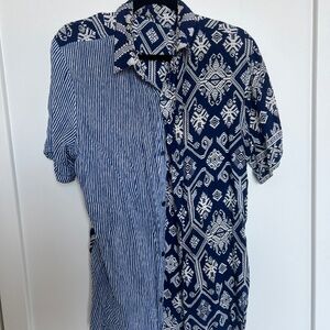 short-sleeve button-up shirt features a unique half-and-half design